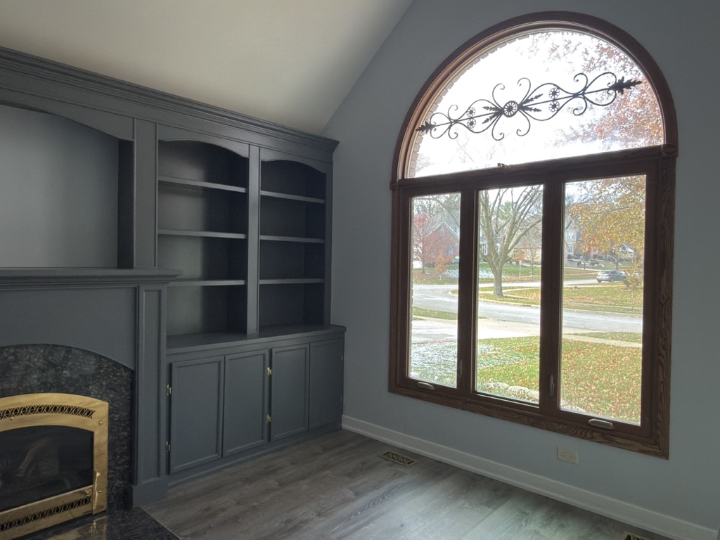 Built-in cabinetry and fireplace surround, after
