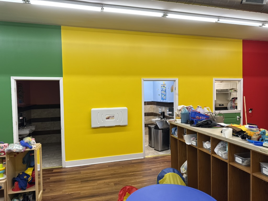 Completed yellow feature wall in childcare facility