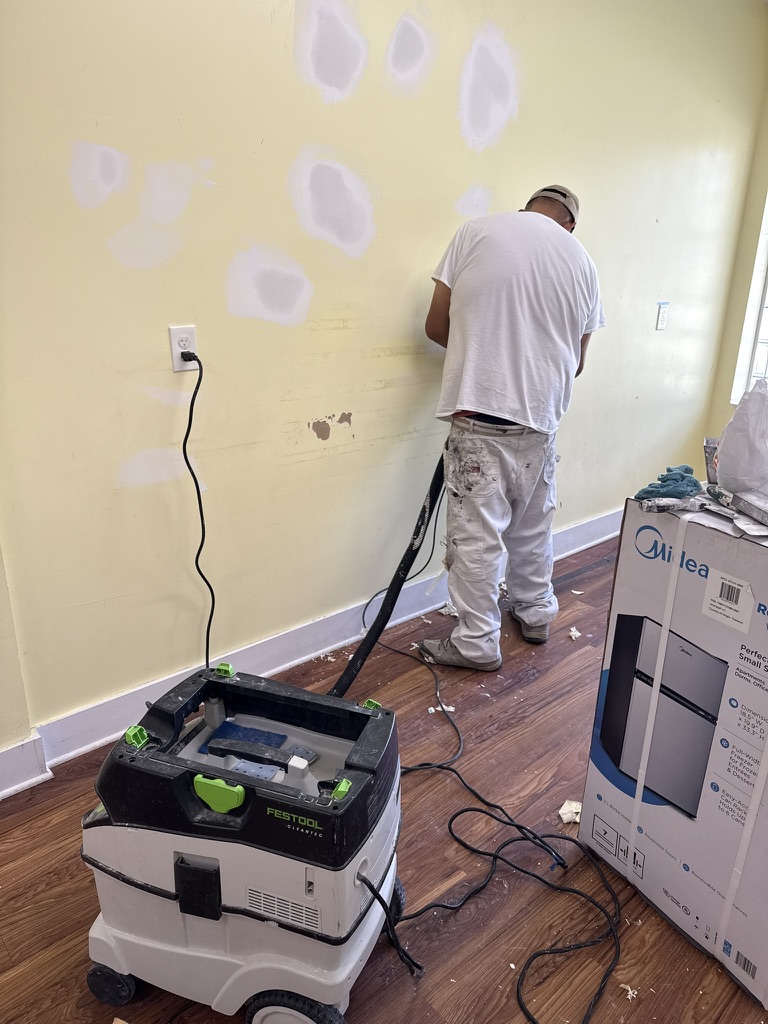 Commercial wall repair and surface preparation in progress