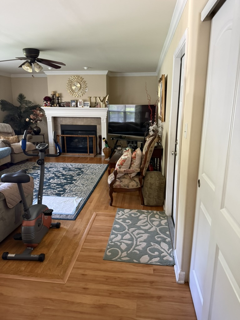 The same living room before painting, with tan walls