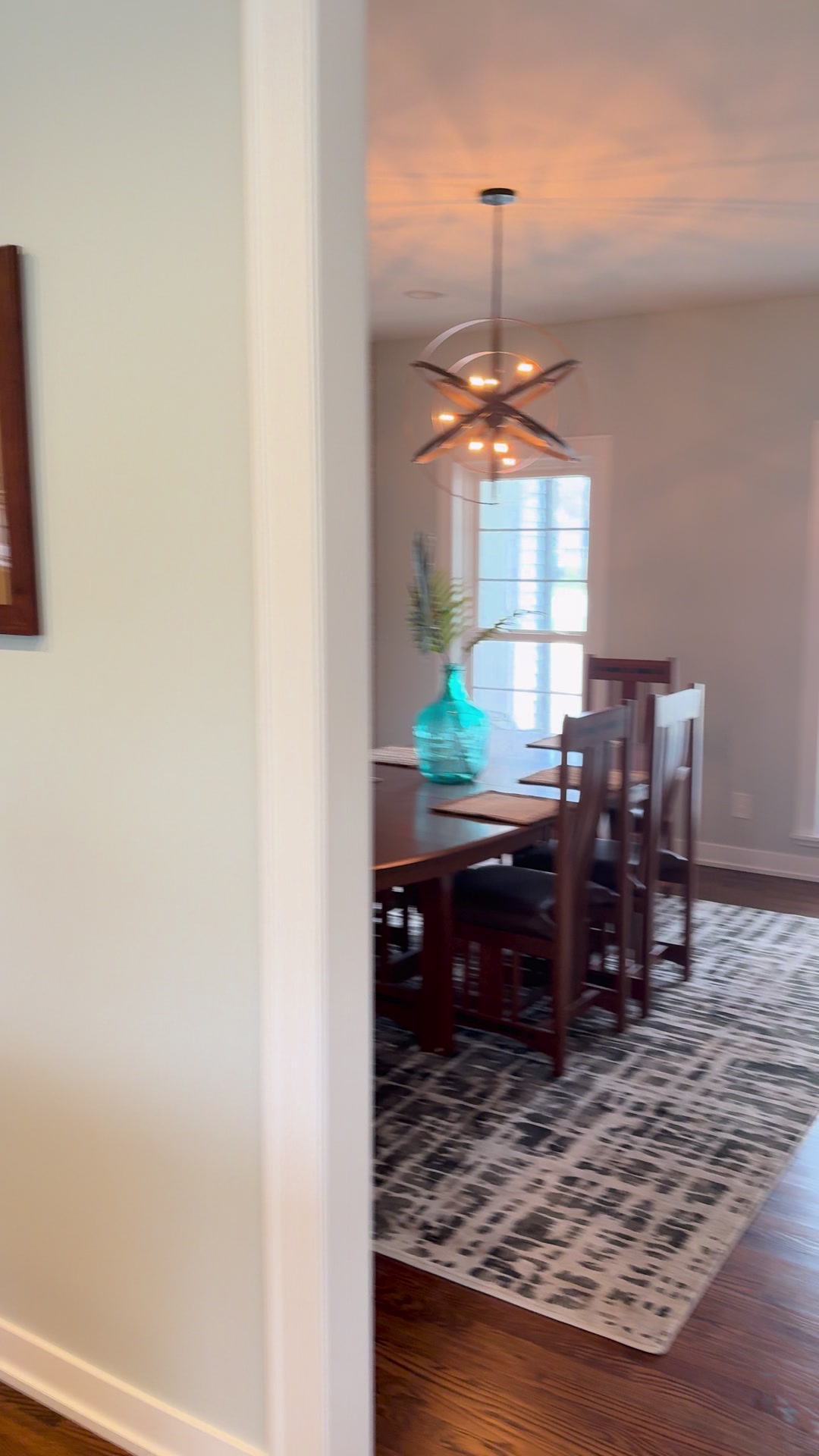 Geneva whole-home repaint · Benjamin Moore, From our project video · Dining room viewed from the hallway