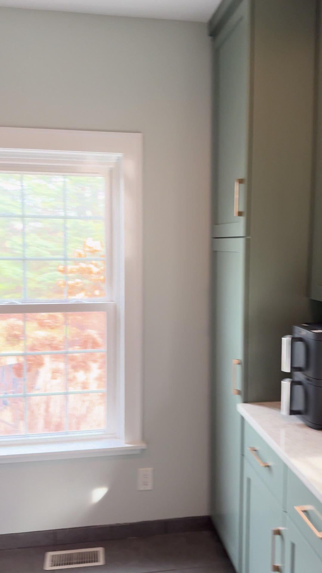 Geneva whole-home repaint · Benjamin Moore, From our project video · Laundry area walls and window trim