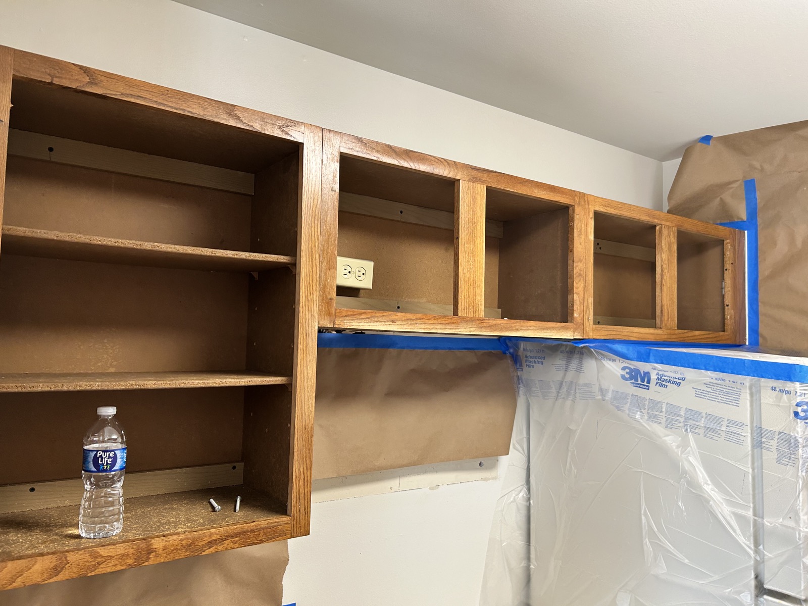 Monroe apartment cabinets · Pure White, Before painting · Upper cabinet detail