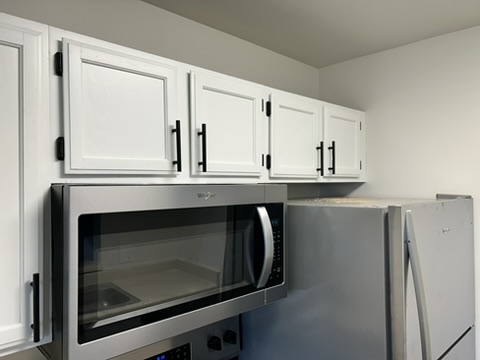 Monroe apartment cabinets · Pure White, Pure White · Finished upper cabinets