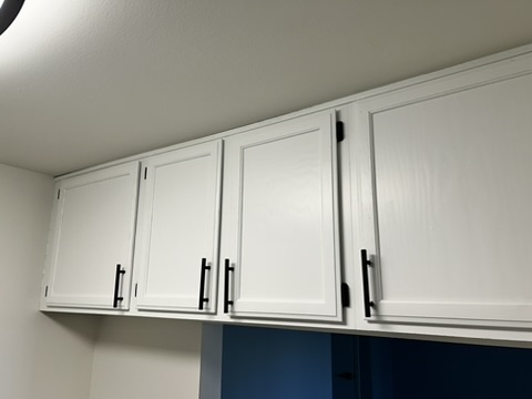 Monroe apartment cabinets · Pure White, Pure White · Upper doors and black handles