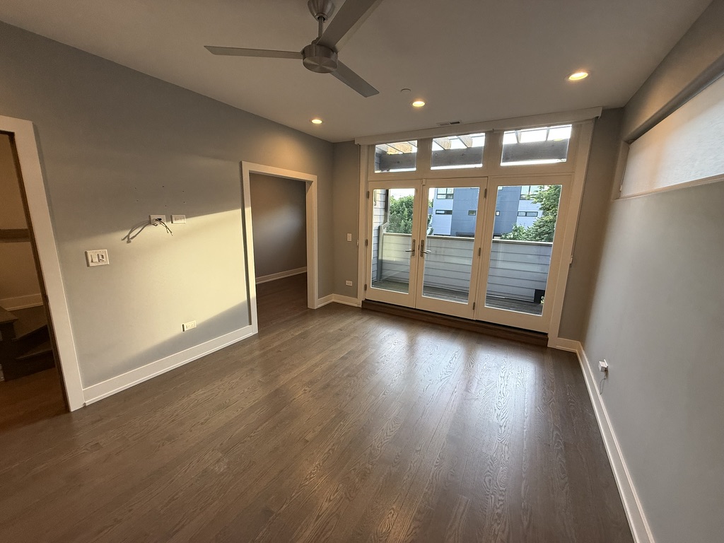 Fresh gray walls and crisp white trim in an open living room