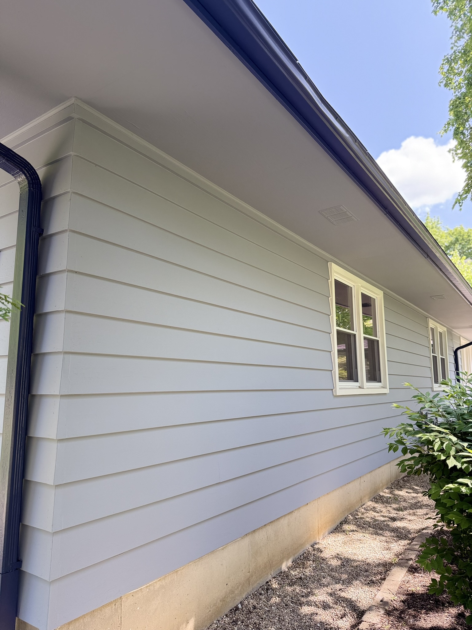 Saint Charles exterior repaint, Finished · Siding, soffit, and contrasting downspout