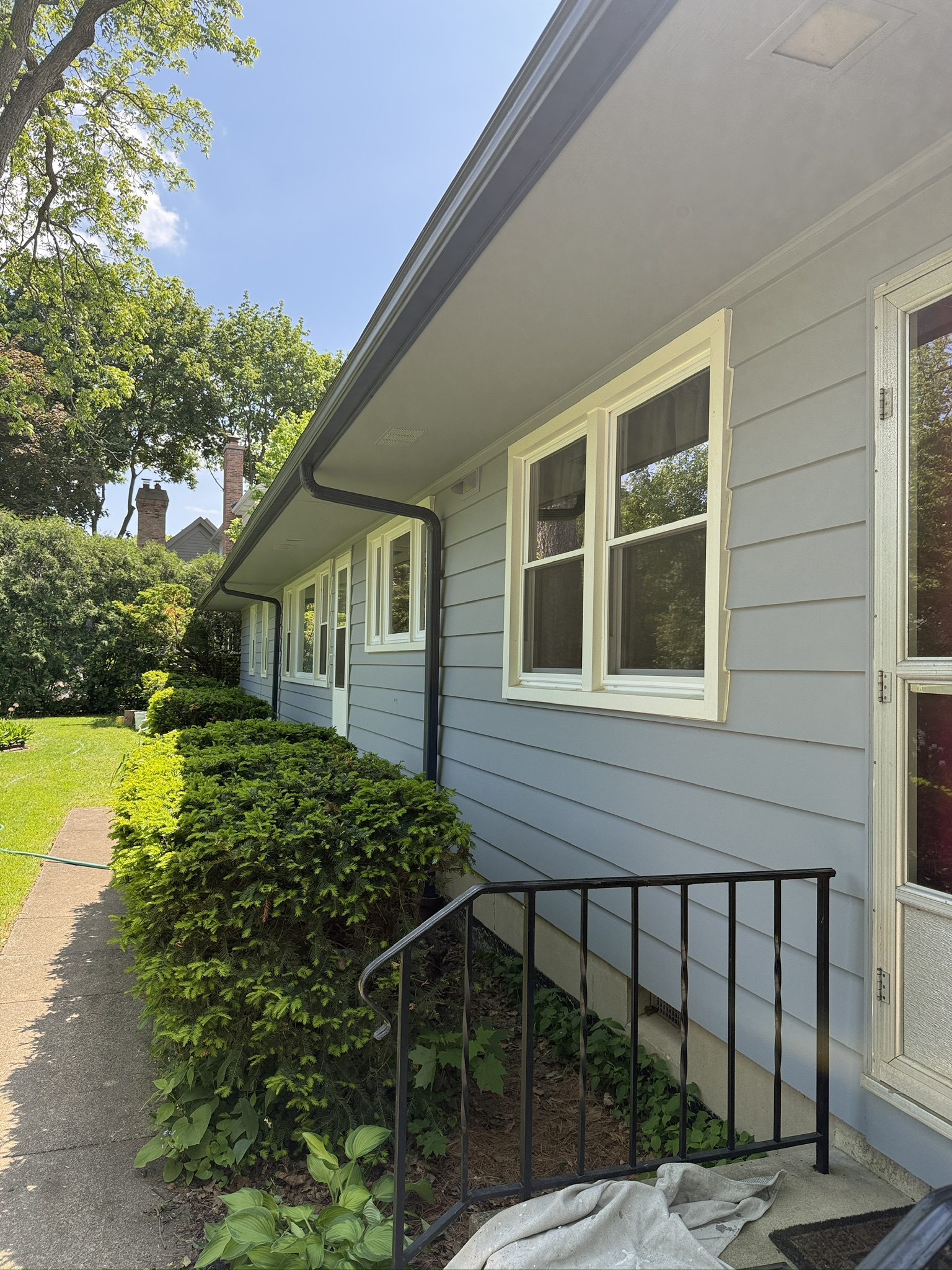 Saint Charles exterior repaint, In progress · Siding, trim, and entry details
