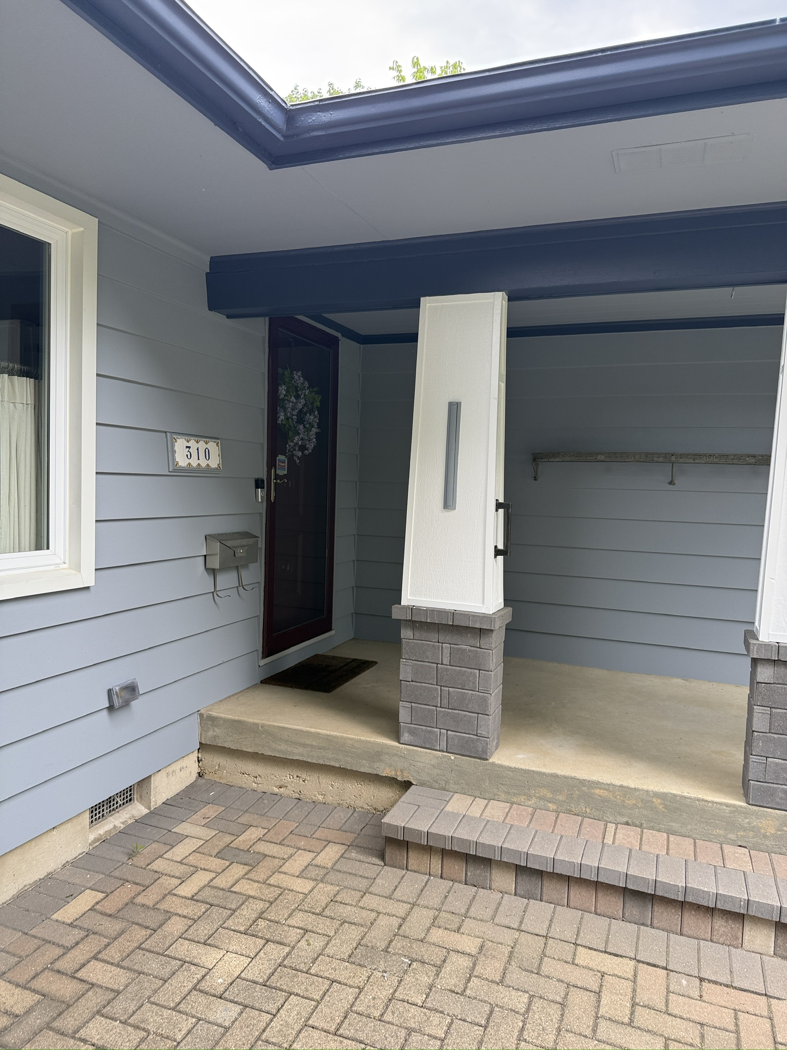Saint Charles exterior repaint, Finished · Porch columns and deep blue beams